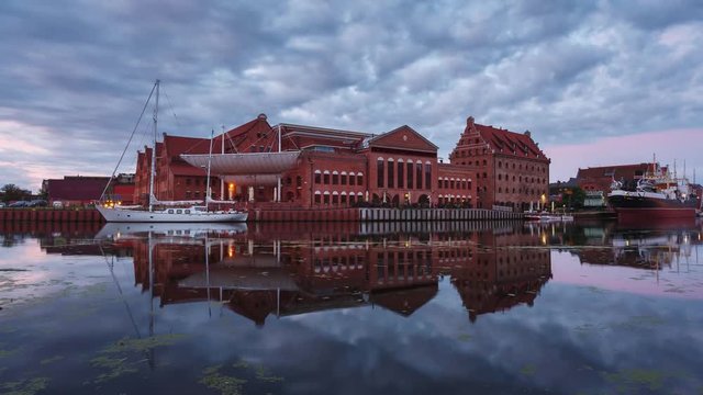 Motion of clouds over the Philharmonic Society of Gdansk in sunrise