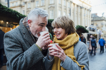 Enjoying Coffee At The Christmas Market