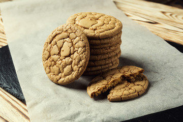 Biscuit sweet cookie background. Domestic stacked butter biscuit pattern concept,close up macro.Homemade cookies on wooden table.Cereal biscuits with the sesame,peanuts,sunflower and amaranth.