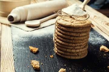 Biscuit sweet cookie background. Domestic stacked butter biscuit pattern concept,close up macro.Homemade cookies on wooden table.Cereal biscuits with the sesame,peanuts,sunflower and amaranth.