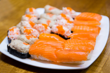 Fresh japanese salmon sushi on wood table