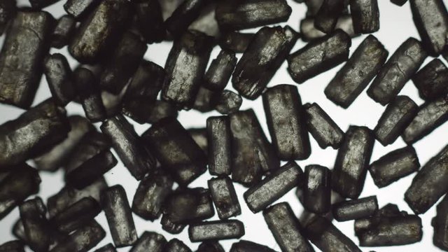 Pour carbon crystals on transparent surface macro