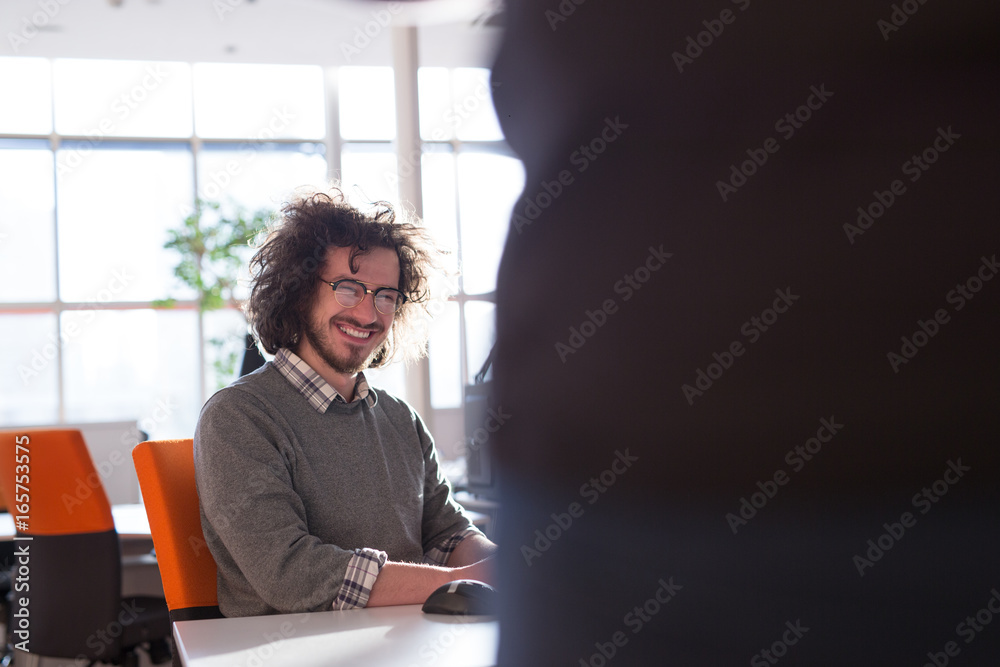 Wall mural businessman working using a computer in startup office