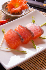 salmon sashimi on white dish on table background