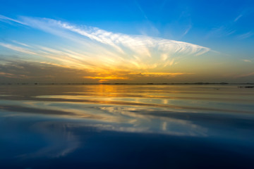Fototapeta premium Mirror Sunrise sky with cloud on the lake.