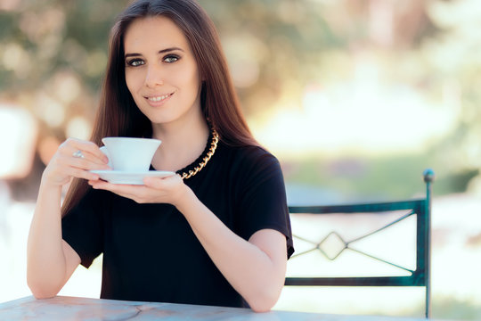 Beautiful Woman with Statement Necklace Having a Cup of Coffee 