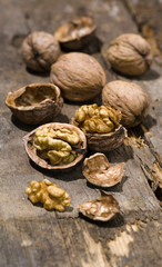 Walnuts on rustic old wooden table