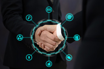 Businessman and Businesswoman handshaking after perfect deal with business icons - Business Successful Concept