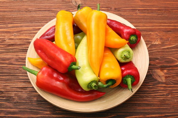 Fresh colored sweet peppers on the plate