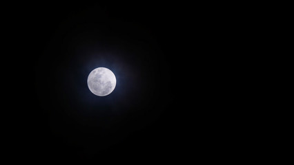 Obraz premium Full Moon or Supermoon / The Full Moon is the moment the entire face of the Moon is illuminated by the Sun's rays. It is the 3rd primary phase