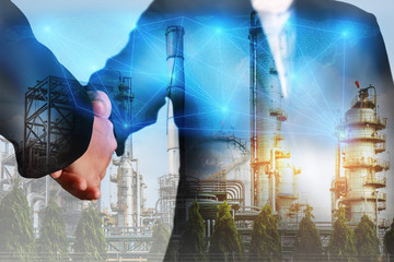 Double exposure of handshake, digital light networking world map, Electric Generating, fuel oil...
