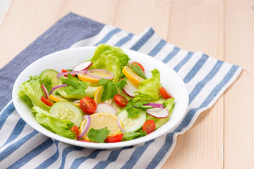 Homemade fresh green vegetable salad on table.