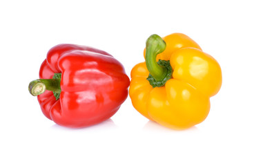 whole fresh yellow and red bell pepper with stem on white background