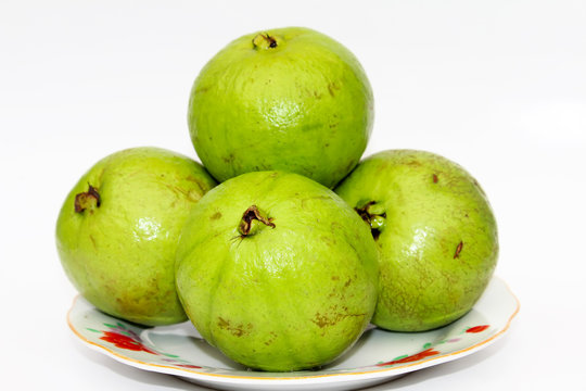 Whole fresh guava fruit on white background