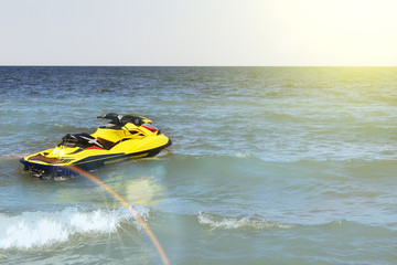 Yellow Jet ski on the beach