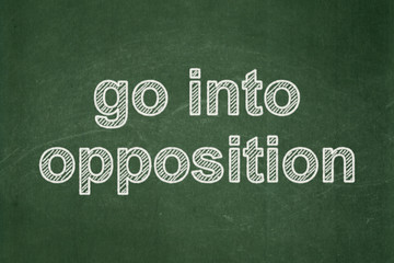 Obraz premium Political concept: Go into Opposition on chalkboard background