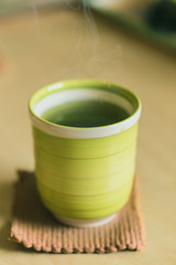 Matcha Japanese healthy drink. Hot Green tea drinking after food meal for good health.