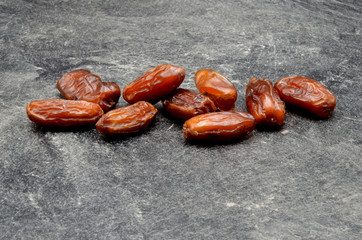 Dates fruit on black background close up photo