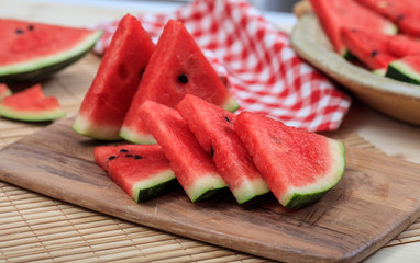 Watermelon slices on a wooden table