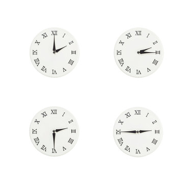 Closeup group of white clock with shadow for decorate show the time in 2 , 2:15 , 2:30 , 2:45 p.m. isolated on white background , beautiful 4 wall clock picture in different time