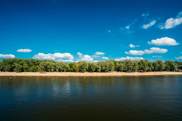 People Resting At Beach At The River