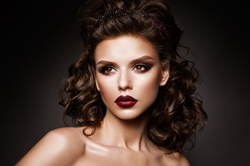 Fototapeta premium Beautiful woman with professional make up and hairstyle