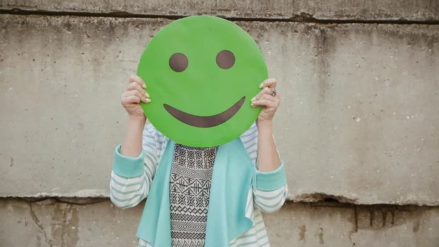 Woman having fun, making silly face fooling around dancing. Smile