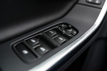 Obraz premium Close-up on power windows and mirrors control buttons