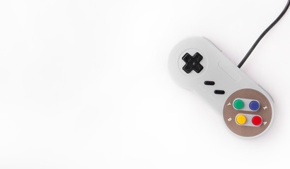 Gray retro joystick on a white background. Video game console GamePad on a white background. Copy space
