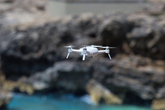 Drone flying above coast