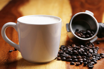 Hot latte , hot coffee and milk foam on wood floor