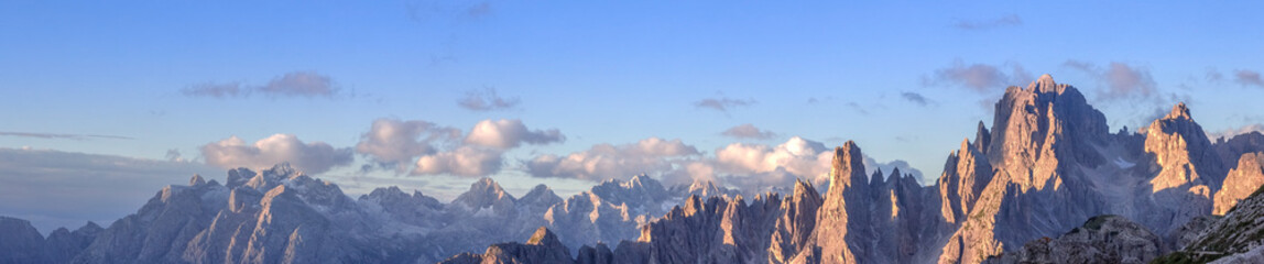 Cadini mountains with Cima Cadin di NE, San Lucano and Torre Siorpaes, as viewed from Rifugio Lavaredo, near the Three Peaks in the italian Dolomites. - obrazy, fototapety, plakaty