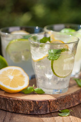 refreshing lemonade drink with mint lime lemon in garden