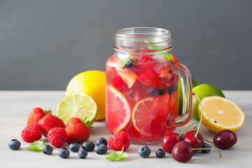 summer berry lemonade with lime and mint in mason jar
