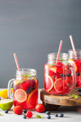 summer berry lemonade with lime and mint in mason jar