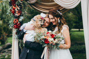 Beautiful wedding couple on the wedding autumn ceremony
