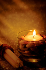 Abstract background for pray or meditation caption. Still life golden candle light with reflection on golden blurred bokeh background