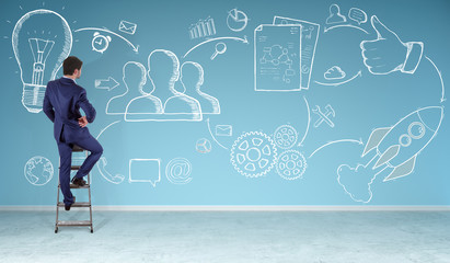 Businessman watching a project sketch on a wall 3D rendering