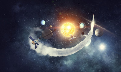 Obraz na płótnie Canvas Rocket flying in space. Mixed media