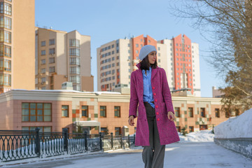 Girl in coat walking