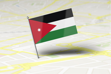 Jordan national flag location pin stuck into a city road map. 3D Rendering