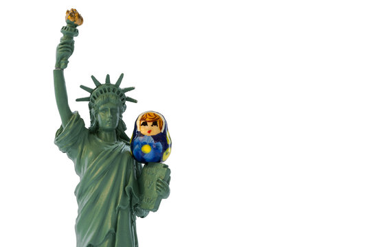 Miniature statue of liberty with a Russian babushka or matryoshka doll sitting on her
