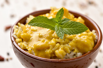 shrimp tikka masala and rice in a bowl