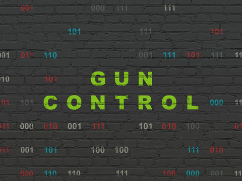 Safety concept: Gun Control on wall background