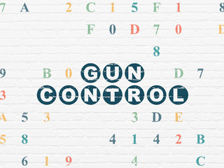 Safety concept: Gun Control on wall background