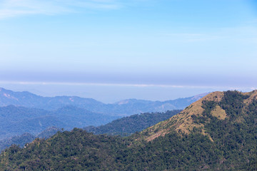 Fototapeta na wymiar high angle viewpoint over rainforest mountains in Thailand.