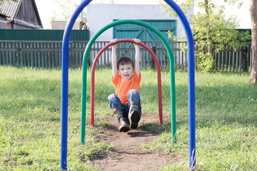 Children playing outdoors. Boy on playground, children activity. Active healthy childhood concept