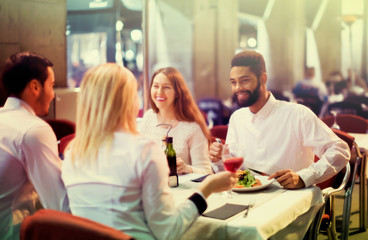 Fototapeta na wymiar middle class people enjoying food in cafe terrace