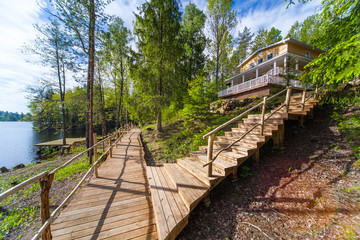 Wooden paths near the lake in the spring forest of Karelia
