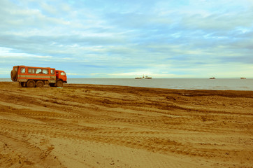 Orange truck on the beach vintage
